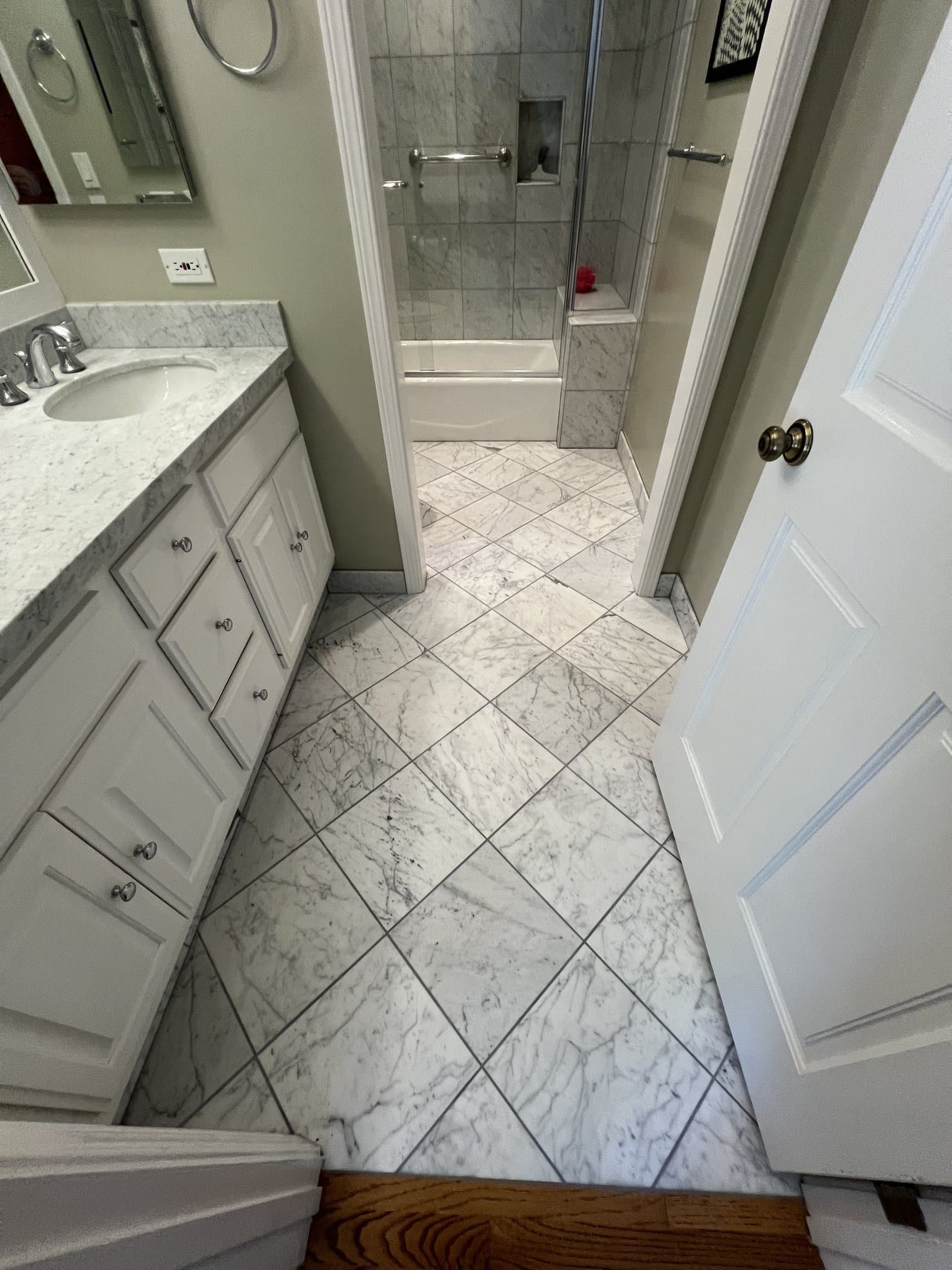 Marble tile bathroom floor with vanity and undermount sink