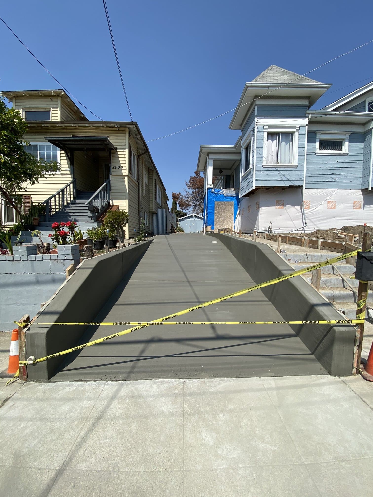Exterior driveway ramp with concrete retaining walls