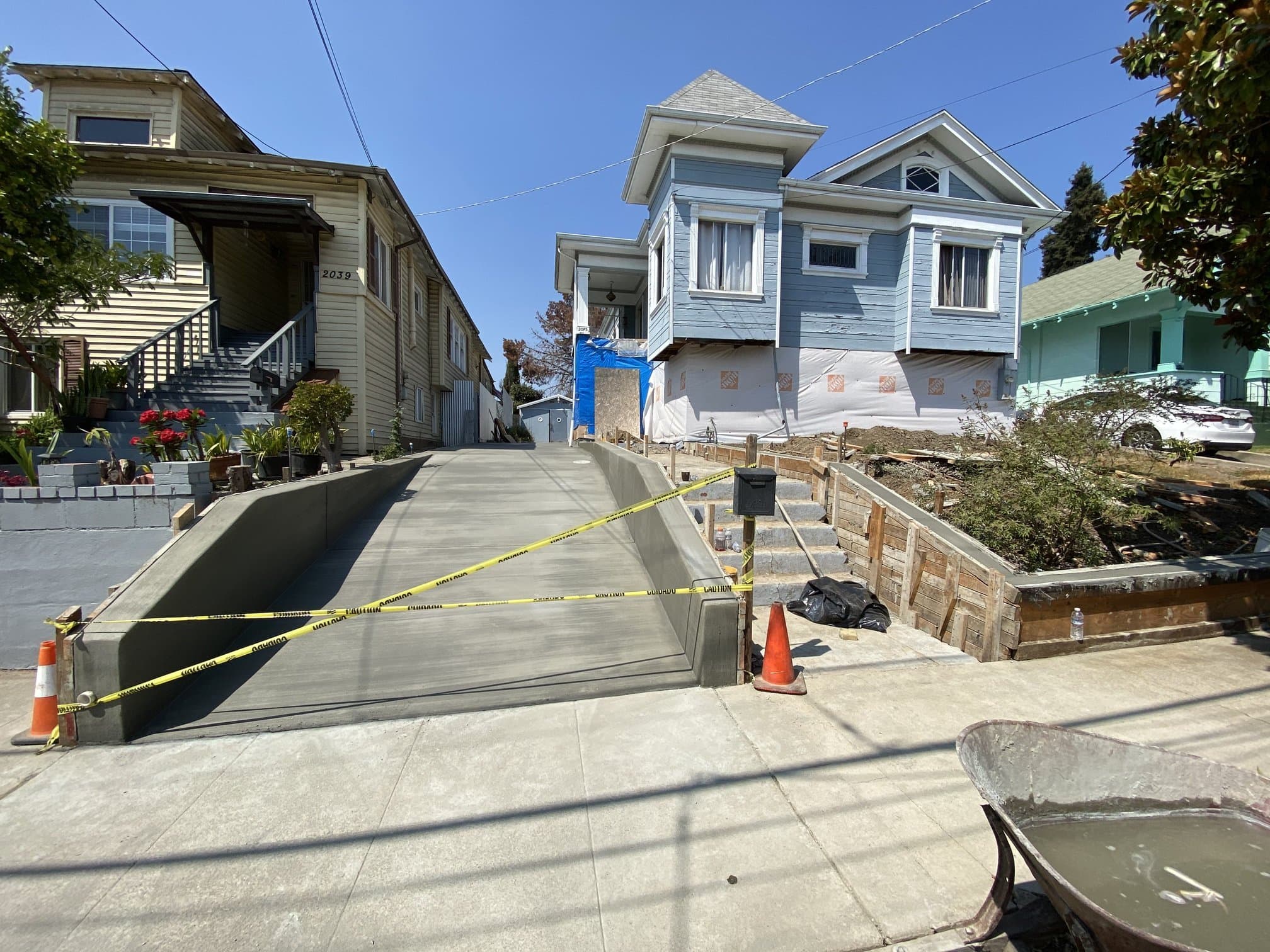 Front driveway with concrete retaining walls and stairs