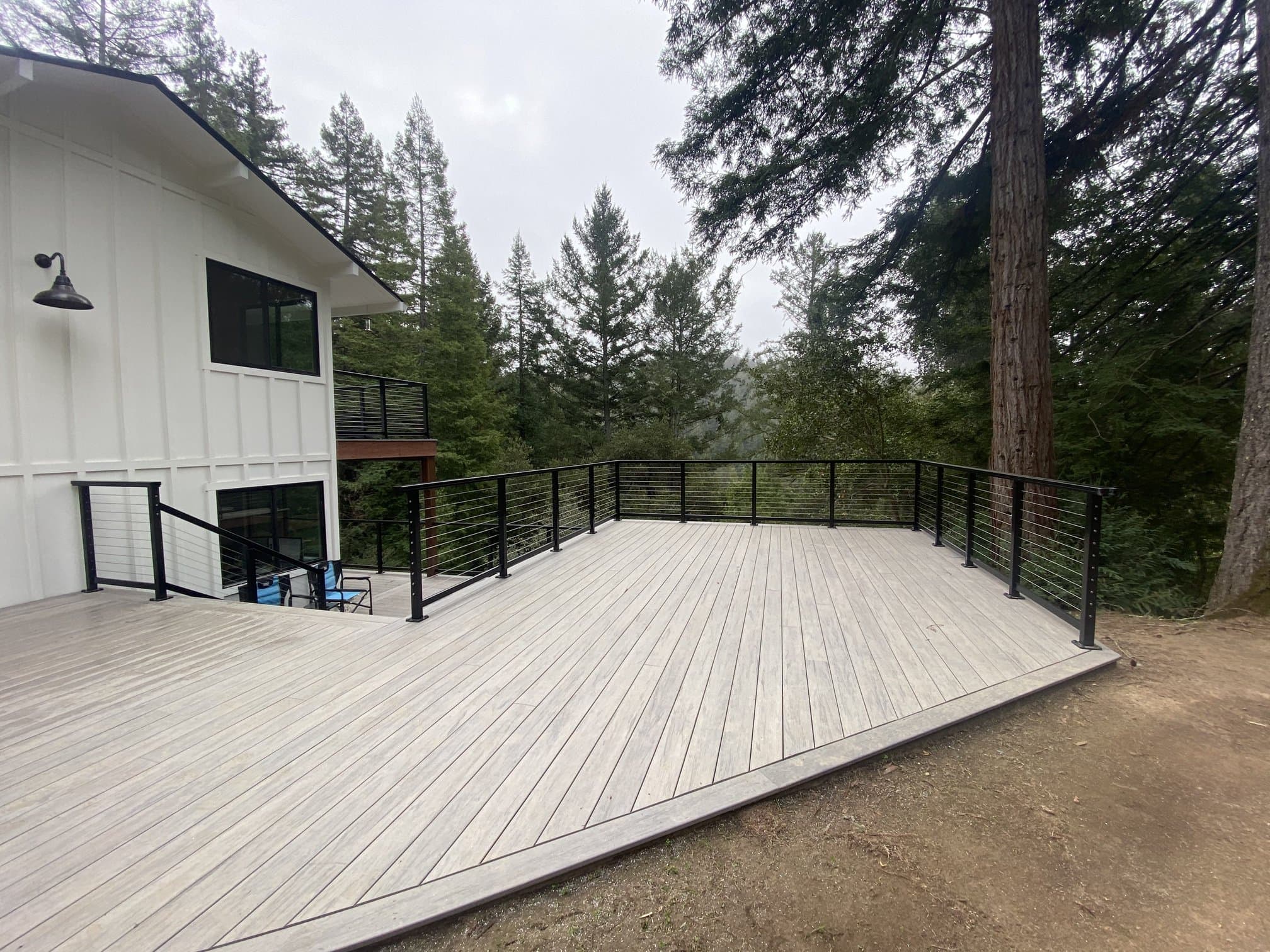 Modern gray composite deck with cable railing