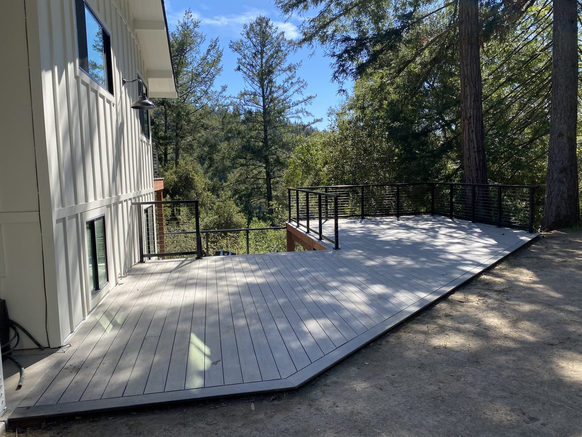Multi-level gray composite deck with cable railing